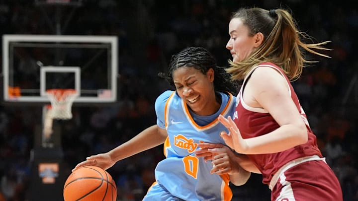 Tennessee's Jewel Spear (0) tries to get to the basket while guarded by Oklahoma's Payton Verhulst (12) during an NCAA college basketball game on Sunday, Jan. 5, 2025, in Knoxville, Tenn.