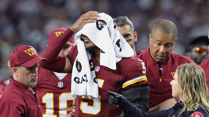 Sep 20, 2026; Arlington, Texas, USA; Washington Commanders quarterback Jayden Daniels (5) reacts as he leaves the game with an apparent injury to his left arm during the second half against the Washington Commanders at AT&T Stadium. Mandatory Credit: Kevin Jairaj-Imagn Images Sep 20, 2026; Arlington, Texas, USA; Washington Commanders quarterback Jayden Daniels (5) reacts as he leaves the game with an apparent injury to his left arm during the second half against the Washington Commanders at AT&T Stadium. Mandatory Credit: Kevin Jairaj-Imagn Images