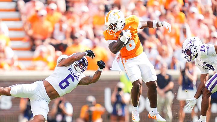 Tennessee running back Javin Gordon (6) spins out of tackle attempts by Furman safety Joshua Tarver (6) and Furman safety Aaron Davis (14) during a college football game between Tennessee and Furman in Neyland Stadium in Knoxville, Tenn., on Sept. 5, 2026.