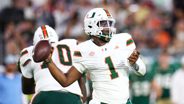 Sep 21, 2024; Tampa, Florida, USA; Miami Hurricanes quarterback Cam Ward (1) throws a pass against the South Florida Bulls in the third quarter at Raymond James Stadium. Mandatory Credit: Nathan Ray Seebeck-Imagn Images