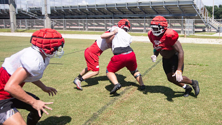 James Johnson, right, a defensive lineman for the North Fort Myers High School football team practices with teammates on Tuesday, Sept. 17, 2024.
