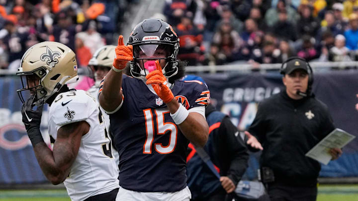 Oct 19, 2025; Chicago, Illinois, USA; Chicago Bears wide receiver Rome Odunze (15) and New Orlenas Saints head coach Kellen Moore react after a Chicago first down during the first half at Soldier Field. Mandatory Credit: David Banks-Imagn Images
