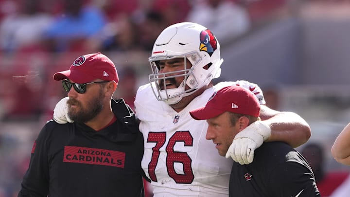 Oct 6, 2024; Santa Clara, California, USA; Arizona Cardinals guard Will Hernandez (76) is helped off of the field by medical personnel after suffering an injury during the fourth quarter against the San Francisco 49ers at Levi's Stadium. Mandatory Credit: Darren Yamashita-Imagn Images Oct 6, 2024; Santa Clara, California, USA; Arizona Cardinals guard Will Hernandez (76) is helped off of the field by medical personnel after suffering an injury during the fourth quarter against the San Francisco 49ers at Levi's Stadium. Mandatory Credit: Darren Yamashita-Imagn Images