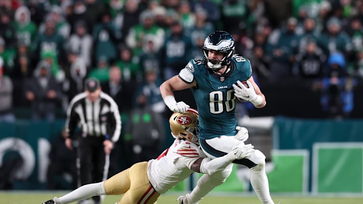 Jan 11, 2026; Philadelphia, PA, USA; Philadelphia Eagles tight end Dallas Goedert (88) carries the ball defended by San Francisco 49ers cornerback Renardo Green (0) during the fourth quarter in an NFC Wild Card Round game at Lincoln Financial Field. 