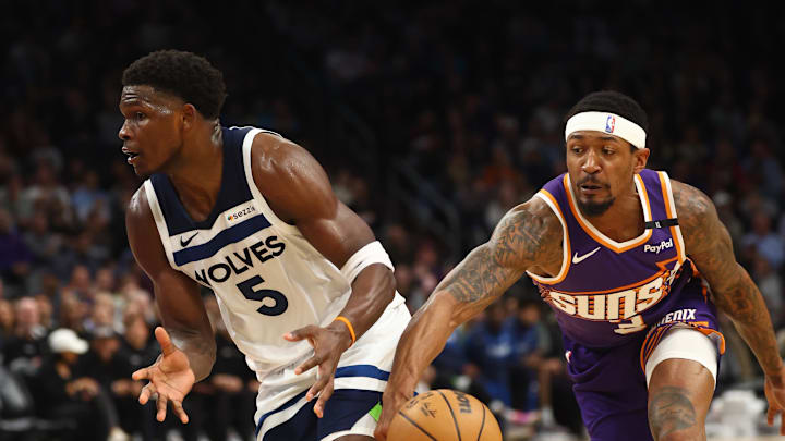 Jan 29, 2025; Phoenix, Arizona, USA; Minnesota Timberwolves guard Anthony Edwards (5) has the ball stolen by Phoenix Suns guard Bradley Beal (3) at Footprint Center. Mandatory Credit: Mark J. Rebilas-Imagn Images