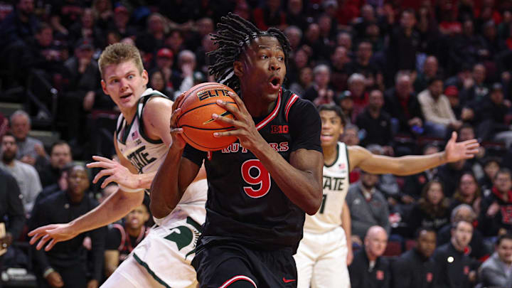 Jan 27, 2026; Piscataway, New Jersey, USA; Rutgers Scarlet Knights forward Dylan Grant (9) goes to the basket in front of Michigan State Spartans forward Jaxon Kohler (0) and guard Jeremy Fears Jr. (1) during the second half at Jersey Mike's Arena. Mandatory Credit: Vincent Carchietta-Imagn Images
