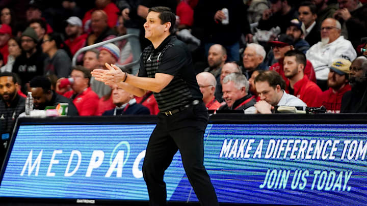 Cincinnati Bearcats head coach Wes Miller cheers on players in the first half of a NCAA men’s basketball game between the Cincinnati Bearcats and Kansas State Wildcats, Wednesday, March 5, 2025, at Fifth Third Arena in Cincinnati.