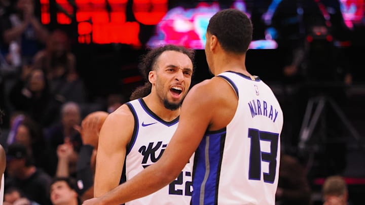 Mar 19, 2025; Sacramento, California, USA; Sacramento Kings guard Devin Carter (22) celebrates with forward Keegan Murray (13) after Murray’s basket against the Cleveland Cavaliers during the third quarter at Golden 1 Center. Mandatory Credit: Kelley L Cox-Imagn Images