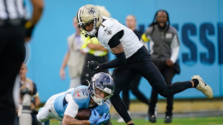 Tennessee Titans wide receiver Mason Kinsey (12) catches a pass underneath New Orleans Saints cornerback Alontae Taylor (1) during the third quarter at Nissan Stadium in Nashville, Tenn., Sunday, Dec. 28, 2025.