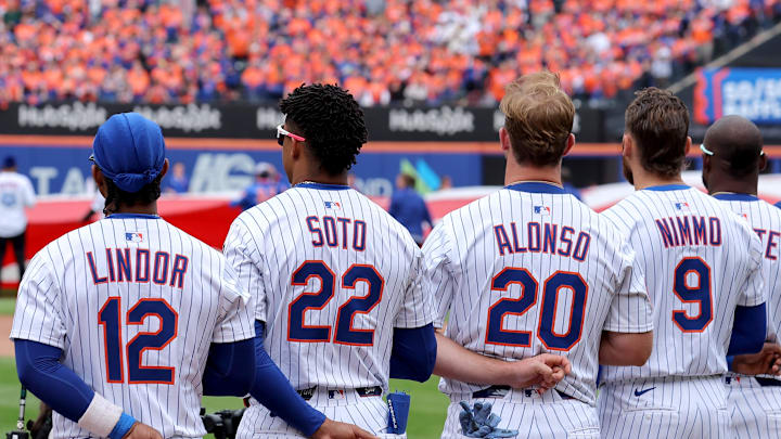 Apr 4, 2025; New York City, New York, USA; New York Mets shortstop Francisco Lindor (12) and right fielder Juan Soto (22) and first baseman Pete Alonso (20) and left fielder Brandon Nimmo (9) stand for the national anthem before the Mets home opener against the Toronto Blue Jays at Citi Field. Mandatory Credit: Brad Penner-Imagn Images