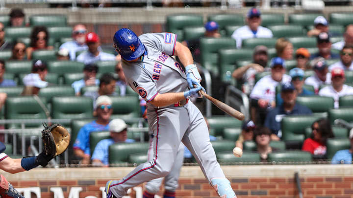 Aug 24, 2025; Cumberland, Georgia, USA; New York Mets first base Pete Alonso (20) swings the bat as it snaps in the game against the Atlanta Braves during the second inning at Truist Park. Mandatory Credit: Jordan Godfree-Imagn Images