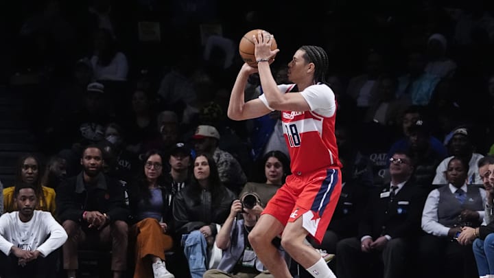 Oct 14, 2024; Brooklyn, New York, USA; Washington Wizards forward Kyshawn George (18) shoots a three-point jump shot against the Brooklyn Nets during the first half at Barclays Center. Mandatory Credit: Gregory Fisher-Imagn Images Oct 14, 2024; Brooklyn, New York, USA; Washington Wizards forward Kyshawn George (18) shoots a three-point jump shot against the Brooklyn Nets during the first half at Barclays Center. Mandatory Credit: Gregory Fisher-Imagn Images