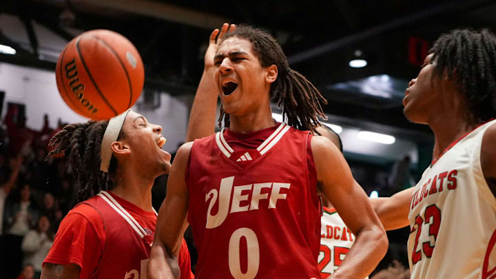 Jeffersonville Red Devils Tre Singleton (0) celebrates scoring against the Lawrence North Wildcats, Saturday, March 16, 2024, during the IHSAA Class 4A semistate game at New Castle High School in Newcastle, Indiana. The Jeffersonville Red Devils defeated the Lawrence North Wildcats, 62-60.