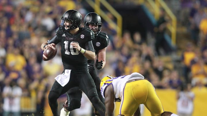 Nov 28, 2015; Baton Rouge, LA, USA; Texas A&M Aggies quarterback Kyle Allen (10) scrambles away from LSU Tigers defensive end Lewis Neal (92) in the second half at Tiger Stadium. LSU defeated Texas A&M Aggies 19-7. Mandatory Credit: Crystal LoGiudice-USA TODAY Sports