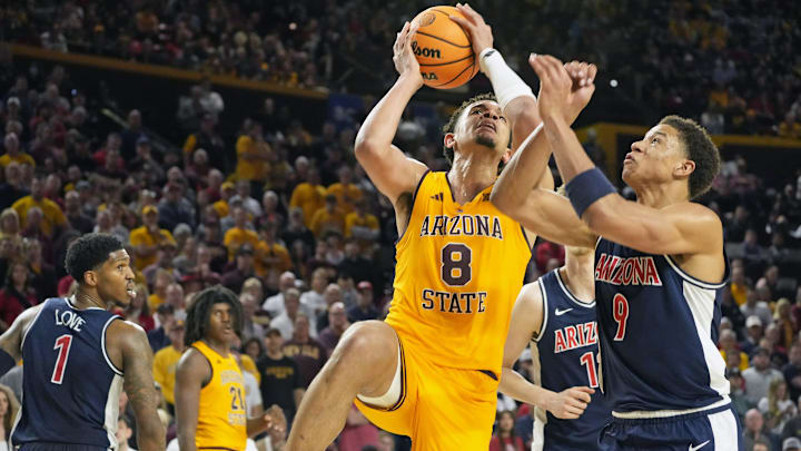 Feb 1, 2025; Tempe, Ariz., U.S.; Arizona State Sun Devils forward Basheer Jihad (8) attempts a shot while being guarded by Arizona Wildcats forward Carter Bryant (9) during a Big 12 menÕs basketball game at Desert Financial Arena.