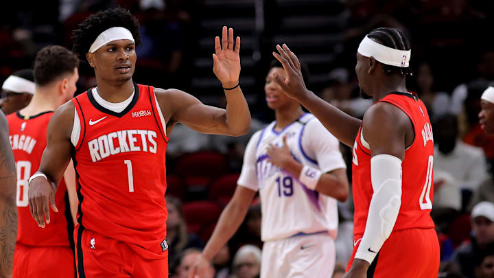 Apr 3, 2026; Houston, Texas, USA; Houston Rockets guard Amen Thompson (1) and Houston Rockets guard Aaron Holiday (0) congratulate each other after a play against the Utah Jazz during the second quarter at Toyota Center. Mandatory Credit: Erik Williams-Imagn Images