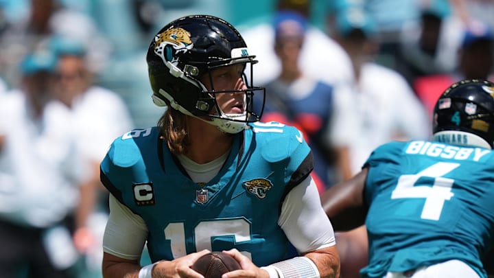 Sep 8, 2024; Miami Gardens, Florida, USA;  Jacksonville Jaguars quarterback Trevor Lawrence (16) drops back to pass against the Miami Dolphins in the first quarter at Hard Rock Stadium. Mandatory Credit: Jim Rassol-Imagn Images