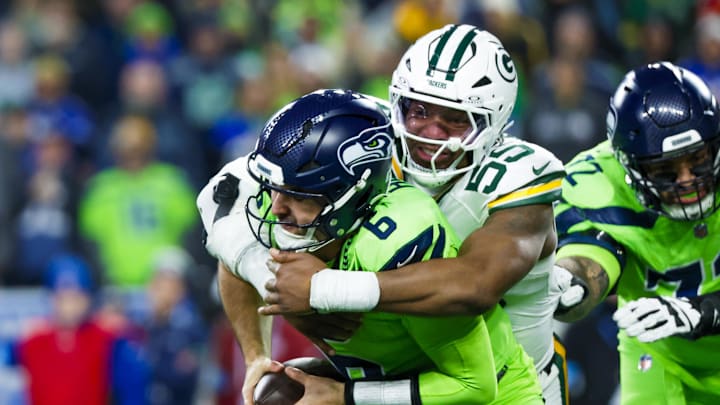 Green Bay Packers defensive end Kingsley Enagbare (55) sacks Seattle Seahawks quarterback Sam Howell (6). Green Bay Packers defensive end Kingsley Enagbare (55) sacks Seattle Seahawks quarterback Sam Howell (6).