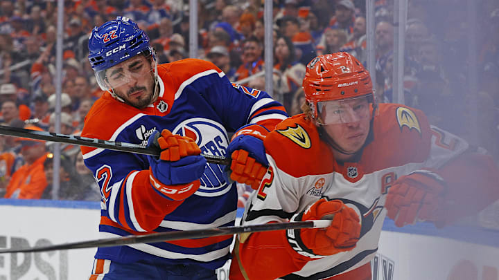 Apr 28, 2026; Edmonton, Alberta, CAN; Edmonton Oilers defensemen Evan Bouchard (2)/ checks Anaheim Ducks defensemen Jackson LaCombe (2) during the first period in game five of the first round of the 2026 Stanley Cup Playoffs at Rogers Place. Mandatory Credit: Perry Nelson-Imagn Images