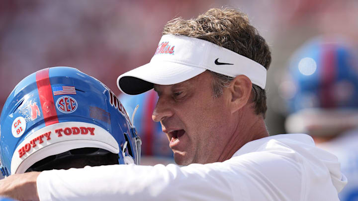 Oct 18, 2025; Athens, Georgia, USA; Mississippi Rebels head coach Lane Kiffin talks with Mississippi Rebels wide receiver Deuce Alexander (11) prior to the game against the Georgia Bulldogs at Sanford Stadium. Mandatory Credit: Dale Zanine-Imagn Images Oct 18, 2025; Athens, Georgia, USA; Mississippi Rebels head coach Lane Kiffin talks with Mississippi Rebels wide receiver Deuce Alexander (11) prior to the game against the Georgia Bulldogs at Sanford Stadium. Mandatory Credit: Dale Zanine-Imagn Images