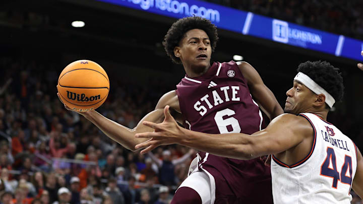 Jan 14, 2025; Auburn, Alabama, USA; Mississippi State Bulldogs guard Dellquan Warren (6) passes the ball around Auburn Tigers center Dylan Cardwell (44) during the first half at Neville Arena. Mandatory Credit: John Reed-Imagn Images Jan 14, 2025; Auburn, Alabama, USA; Mississippi State Bulldogs guard Dellquan Warren (6) passes the ball around Auburn Tigers center Dylan Cardwell (44) during the first half at Neville Arena. Mandatory Credit: John Reed-Imagn Images