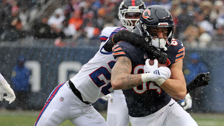 Nov 9, 2025; Chicago, Illinois, USA; Chicago Bears tight end Colston Loveland (84) makes a catch over New York Giants cornerback Cordale Flott (28) during the second half at Soldier Field. 