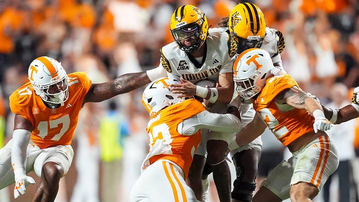 Sep 19, 2026; Knoxville, Tennessee, USA; The Tennessee defense swarms Kennesaw State quarterback Rickie Collins (1) during Tennesseea?TMs college football game against Kennesaw State at Neyland Stadium in Knoxville on Sept. 19, 2026. Mandatory Credit: Saul Young/News Sentinel-USA TODAY NETWORK via Imagn Images Sep 19, 2026; Knoxville, Tennessee, USA; The Tennessee defense swarms Kennesaw State quarterback Rickie Collins (1) during Tennesseea?TMs college football game against Kennesaw State at Neyland Stadium in Knoxville on Sept. 19, 2026. Mandatory Credit: Saul Young/News Sentinel-USA TODAY NETWORK via Imagn Images