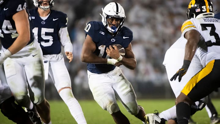 Penn State football running back Nicholas Singleton carries the ball during the second half of a White Out football game against Iowa Saturday, Sept. 23, 2023