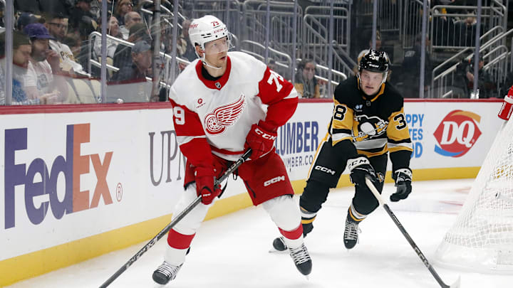 Oct 1, 2024; Pittsburgh, Pennsylvania, USA;  Detroit Red Wings forward Alex Chiasson (79) moves the puck ahed of Pittsburgh Penguins defenseman Owen Pickering (38) during the second period at PPG Paints Arena. Mandatory Credit: Charles LeClaire-Imagn Images