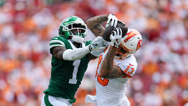 Sep 21, 2025; Tampa, Florida, USA; Tampa Bay Buccaneers wide receiver Mike Evans (13) catches pass defended boy New York Jets cornerback Sauce Gardner (1) in the third quarter at Raymond James Stadium. Mandatory Credit: Nathan Ray Seebeck-Imagn Images
