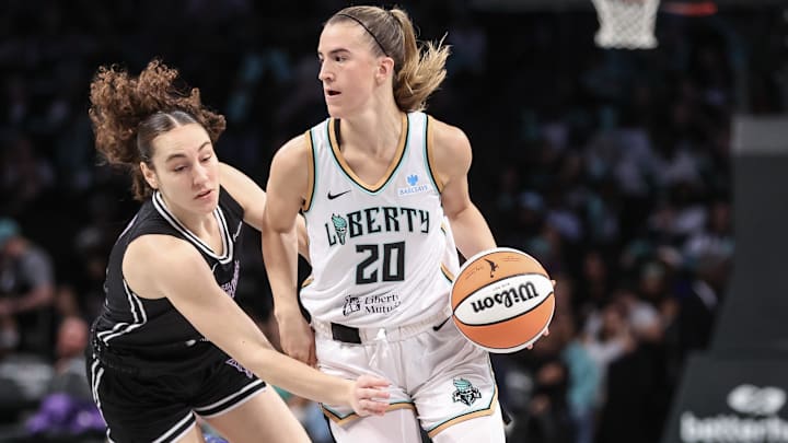 May 27, 2025; Brooklyn, New York, USA; New York Liberty guard Sabrina Ionescu (20) drives past Golden State Valkyries guard Carla Leite (0) in the third quarter at Barclays Center. Mandatory Credit: Wendell Cruz-Imagn Images May 27, 2025; Brooklyn, New York, USA; New York Liberty guard Sabrina Ionescu (20) drives past Golden State Valkyries guard Carla Leite (0) in the third quarter at Barclays Center. Mandatory Credit: Wendell Cruz-Imagn Images