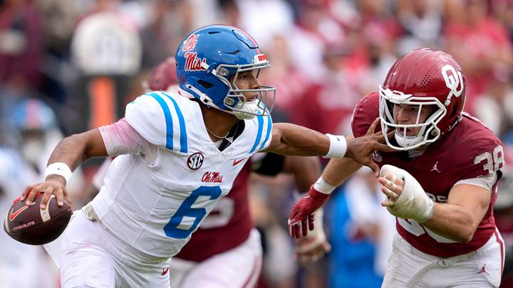 Ole Miss Rebels quarterback Trinidad Chambliss tries to pass as Oklahoma Sooners linebacker Owen Heinecke Ole Miss Rebels quarterback Trinidad Chambliss tries to pass as Oklahoma Sooners linebacker Owen Heinecke
