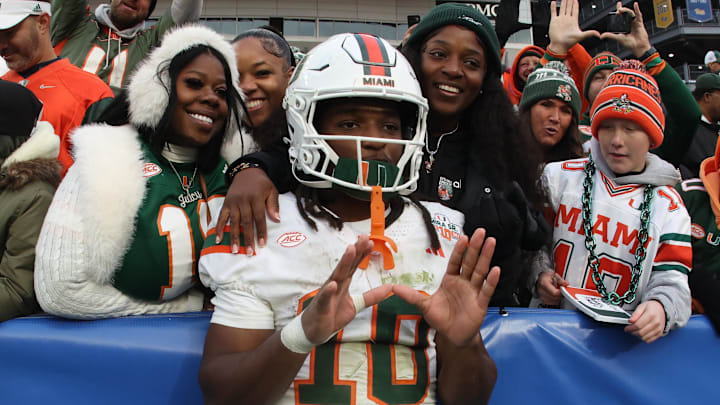 Nov 29, 2025; Pittsburgh, Pennsylvania, USA; Miami Hurricanes wide receiver Malachi Toney (10) celebrates with family and friends after defeating the Pittsburgh Panthers at Acrisure Stadium. Mandatory Credit: Charles LeClaire-Imagn Images Nov 29, 2025; Pittsburgh, Pennsylvania, USA; Miami Hurricanes wide receiver Malachi Toney (10) celebrates with family and friends after defeating the Pittsburgh Panthers at Acrisure Stadium. Mandatory Credit: Charles LeClaire-Imagn Images