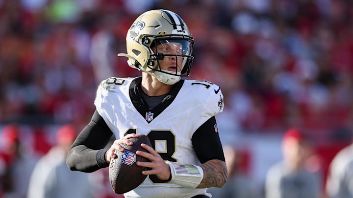 Jan 5, 2025; Tampa, Florida, USA; New Orleans Saints quarterback Spencer Rattler (18) drops back to pass against the Tampa Bay Buccaneers in the fourth quarter at Raymond James Stadium. Mandatory Credit: Nathan Ray Seebeck-Imagn Images