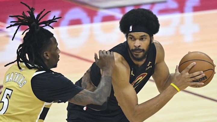 Feb 11, 2026; Cleveland, Ohio, USA; Washington Wizards guard Jamir Watkins (5) defends Cleveland Cavaliers center Jarrett Allen (31) in the first quarter at Rocket Arena. Mandatory Credit: David Richard-Imagn Images