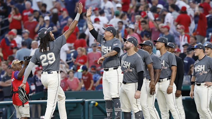 Sep 28, 2024; Washington, District of Columbia, USA; Washington Nationals outfielder James Wood (29) celebrates with Nationals second base Ildemaro Vargas (14) after their game against the Philadelphia Phillies at Nationals Park.