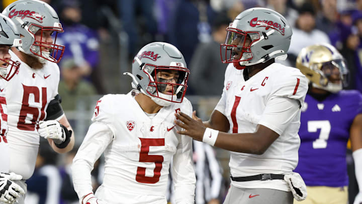 Nov 25, 2023; Seattle, Washington, USA; Washington State Cougars quarterback Cameron Ward (1) and