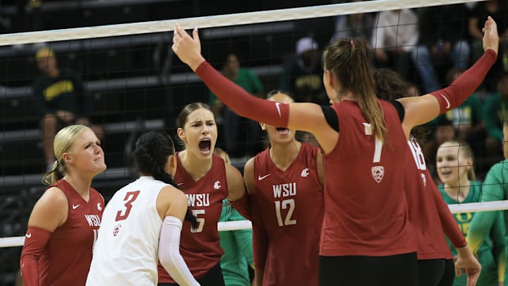Washington State players celebrate a point against Oregon during their volleyball match Sunday, Oct, 1, 2023.