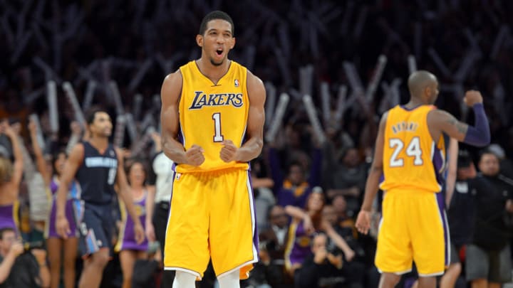 Dec 18, 2012; Los Angeles, CA, USA; Los Angeles Lakers guards Darius Morris (1) and Kobe Bryant (24) celebrate at the end of the game against the Charlotte Bobcats at the Staples Center. The Lakers defeated the Bobcats 101-100. Mandatory Credit: Kirby Lee/Image of Sport-USA TODAY Sports