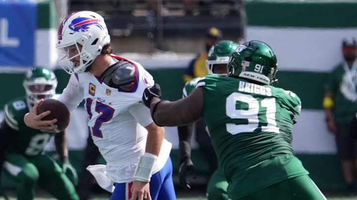 Sep 14, 2025; East Rutherford, New Jersey, USA; New York Jets defensive tackle Jowon Briggs (91) attempts to sack Buffalo Bills quarterback Josh Allen (17) during the first half at MetLife Stadium. Mandatory Credit: Robert Deutsch-Imagn Images