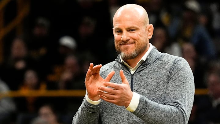 Penn State Nittany Lions wrestling coach Cael Sanderson reacts during a Big Ten match against the Iowa Hawkeyes.