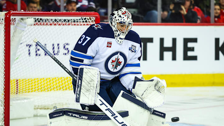Nov 15, 2025; Calgary, Alberta, CAN; Winnipeg Jets goaltender Connor Hellebuyck (37) makes a save against the Calgary Flames during the second period at Scotiabank Saddledome. Mandatory Credit: Sergei Belski-Imagn Images Nov 15, 2025; Calgary, Alberta, CAN; Winnipeg Jets goaltender Connor Hellebuyck (37) makes a save against the Calgary Flames during the second period at Scotiabank Saddledome. Mandatory Credit: Sergei Belski-Imagn Images