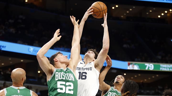 Oct 8, 2025; Memphis, Tennessee, USA; Memphis Grizzlies center PJ Hall (16) collects a rebound over Boston Celtics center Luka Garza (52) during the third quarter at FedExForum. Mandatory Credit: Petre Thomas-Imagn Images Oct 8, 2025; Memphis, Tennessee, USA; Memphis Grizzlies center PJ Hall (16) collects a rebound over Boston Celtics center Luka Garza (52) during the third quarter at FedExForum. Mandatory Credit: Petre Thomas-Imagn Images