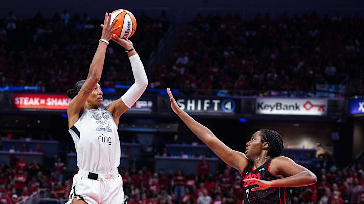 Sep 26, 2025; Indianapolis, Indiana, USA; Las Vegas Aces center A'ja Wilson (22) shoots the ball while Indiana Fever forward Aliyah Boston (7) defends during game three of the second round for the 2025 WNBA Playoffs at Gainbridge Fieldhouse. Mandatory Credit: Trevor Ruszkowski-Imagn Images Sep 26, 2025; Indianapolis, Indiana, USA; Las Vegas Aces center A'ja Wilson (22) shoots the ball while Indiana Fever forward Aliyah Boston (7) defends during game three of the second round for the 2025 WNBA Playoffs at Gainbridge Fieldhouse. Mandatory Credit: Trevor Ruszkowski-Imagn Images
