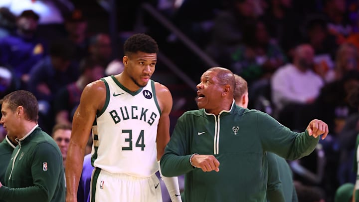 Feb 6, 2024; Phoenix, Arizona, USA; Milwaukee Bucks head coach Doc Rivers talks to forward Giannis Antetokounmpo (34) against the Phoenix Suns at Footprint Center. Mandatory Credit: Mark J. Rebilas-Imagn Images
