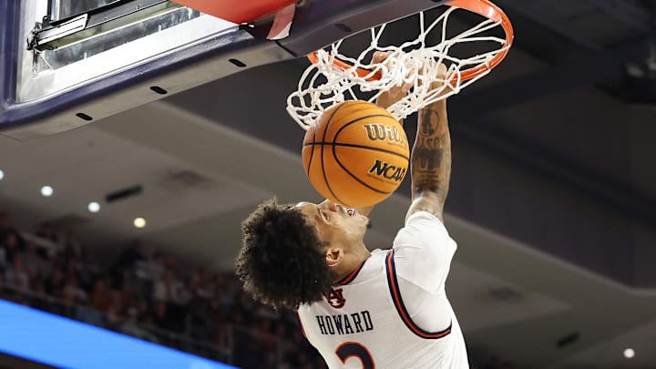 Dec 30, 2024; Auburn, Alabama, USA;  Auburn Tigers forward Jahki Howard (3) makes a reverse dunk against the Monmouth Hawks during the second half at Neville Arena. Mandatory Credit: John Reed-Imagn Images