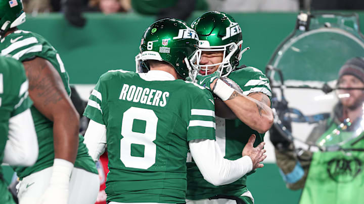 Jan 5, 2025; East Rutherford, New Jersey, USA; New York Jets wide receiver Allen Lazard (10) celebrates his touchdown reception with quarterback Aaron Rodgers (8)  during the first half against the Miami Dolphins at MetLife Stadium. Mandatory Credit: Vincent Carchietta-Imagn Images