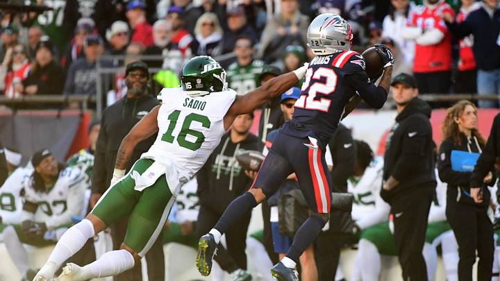 Oct 18, 2026; Foxborough, Massachusetts, USA; New England Patriots cornerback Charles Woods (22) intercepts the ball intended for New York Jets tight end Kenyon Sadiq (16) during the second half at Gillette Stadium. Mandatory Credit: Bob DeChiara-Imagn Images Oct 18, 2026; Foxborough, Massachusetts, USA; New England Patriots cornerback Charles Woods (22) intercepts the ball intended for New York Jets tight end Kenyon Sadiq (16) during the second half at Gillette Stadium. Mandatory Credit: Bob DeChiara-Imagn Images