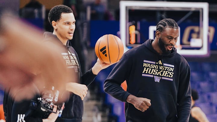 Chris Conway, holding the basketball, missed the entire UW season because of knee issues. 