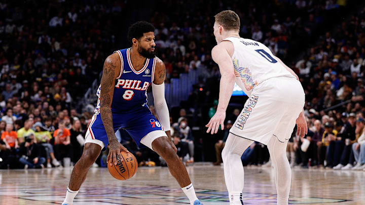Jan 21, 2025; Denver, Colorado, USA; Philadelphia 76ers forward Paul George (8) controls the ball as Denver Nuggets guard Christian Braun (0) Denver Nuggets in the third quarter at Ball Arena. Mandatory Credit: Isaiah J. Downing-Imagn Images Jan 21, 2025; Denver, Colorado, USA; Philadelphia 76ers forward Paul George (8) controls the ball as Denver Nuggets guard Christian Braun (0) Denver Nuggets in the third quarter at Ball Arena. Mandatory Credit: Isaiah J. Downing-Imagn Images